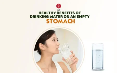 A refreshing glass of water placed on a table, symbolizing the health benefits of drinking water on an empty stomach.