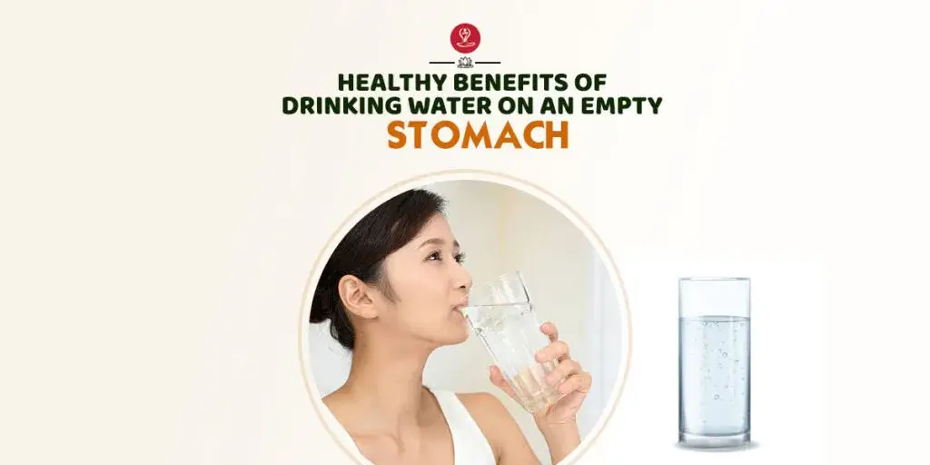 A refreshing glass of water placed on a table, symbolizing the health benefits of drinking water on an empty stomach.