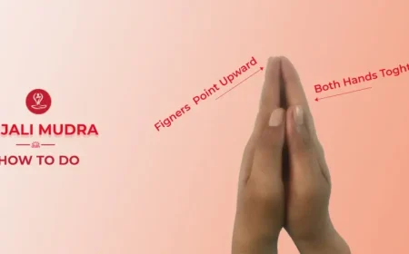 Woman practicing Anjali Mudra during meditation.