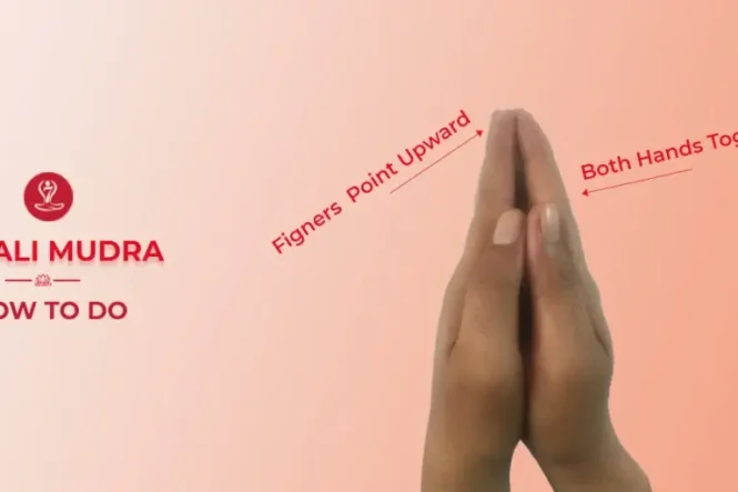 Woman practicing Anjali Mudra during meditation.