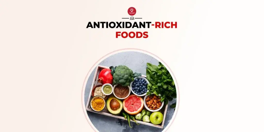 Assortment of antioxidant-rich foods like berries and nuts on a wooden table