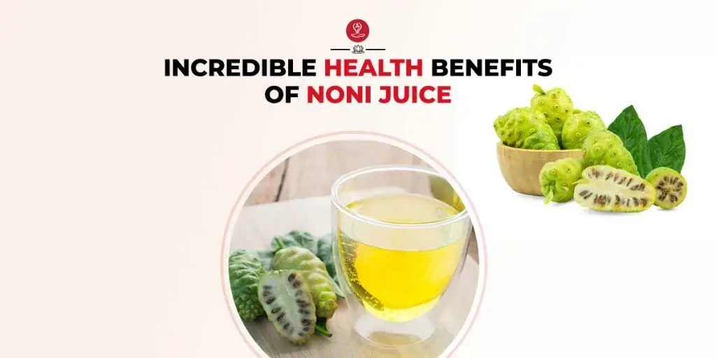 Glass of noni juice with fresh noni fruits and leaves