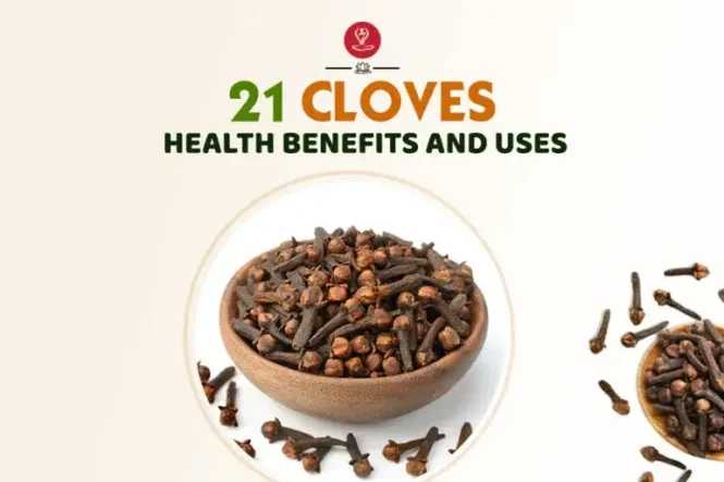 Whole cloves and clove powder on a wooden spoon