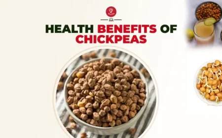 Healthy bowl of cooked chickpeas with vegetables and herbs on a wooden table