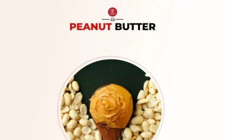 Natural peanut butter in a jar with peanuts around