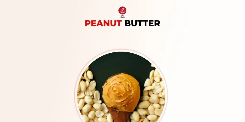 Natural peanut butter in a jar with peanuts around