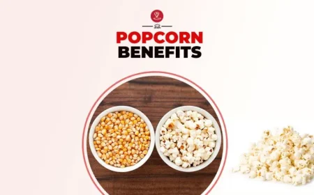 A bowl of freshly air-popped popcorn surrounded by healthy ingredients, highlighting popcorn benefits for digestion, weight management, fiber intake, and overall wellness.